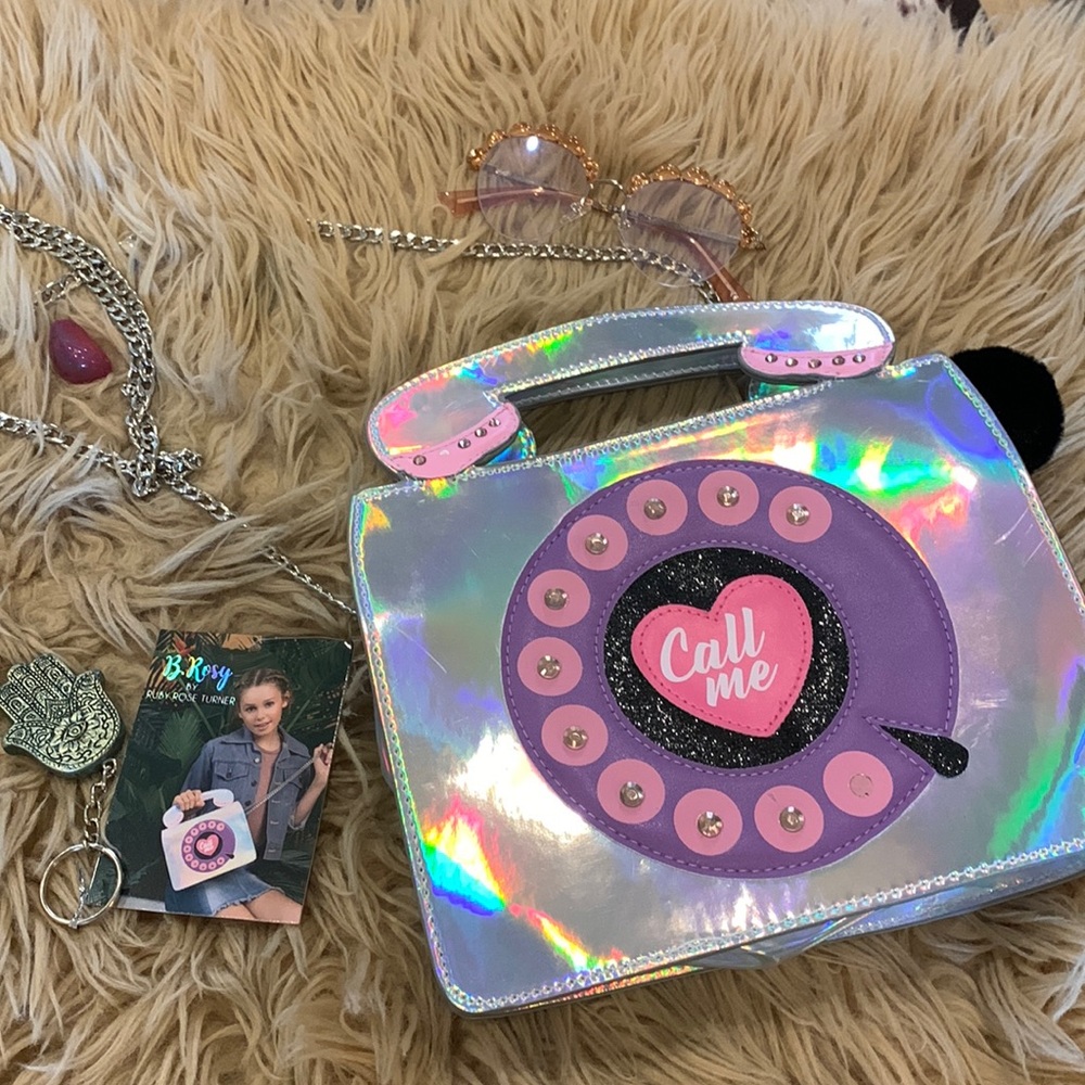 Old phone bag shiny silver rhinestones ad a good little pop to it